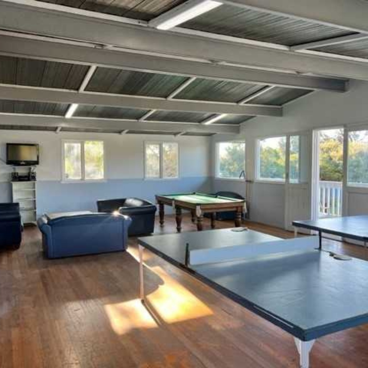 beach park tourist caravan park recreation room with table tennis table and couches