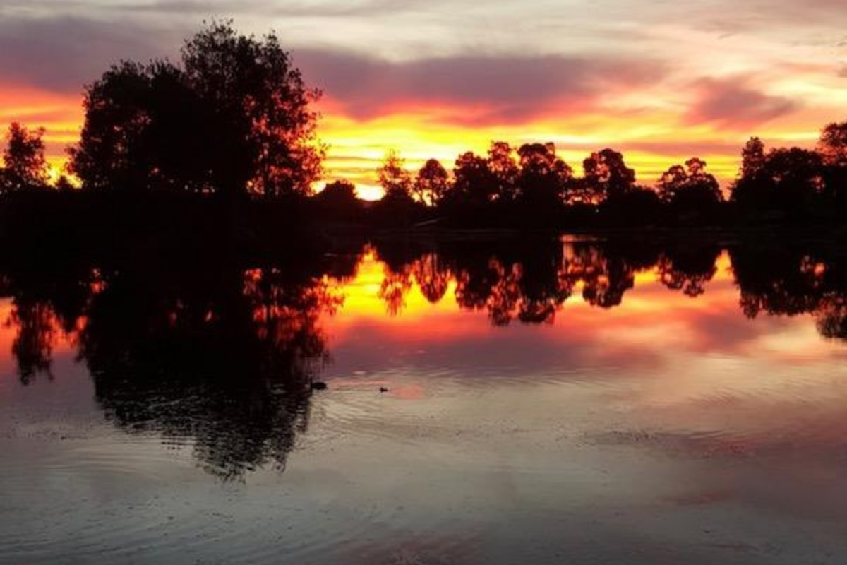 lake anderson caravan park lake at sunset with reflection on the water